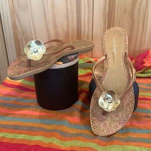 West Loop floral flops in gold. Size 7